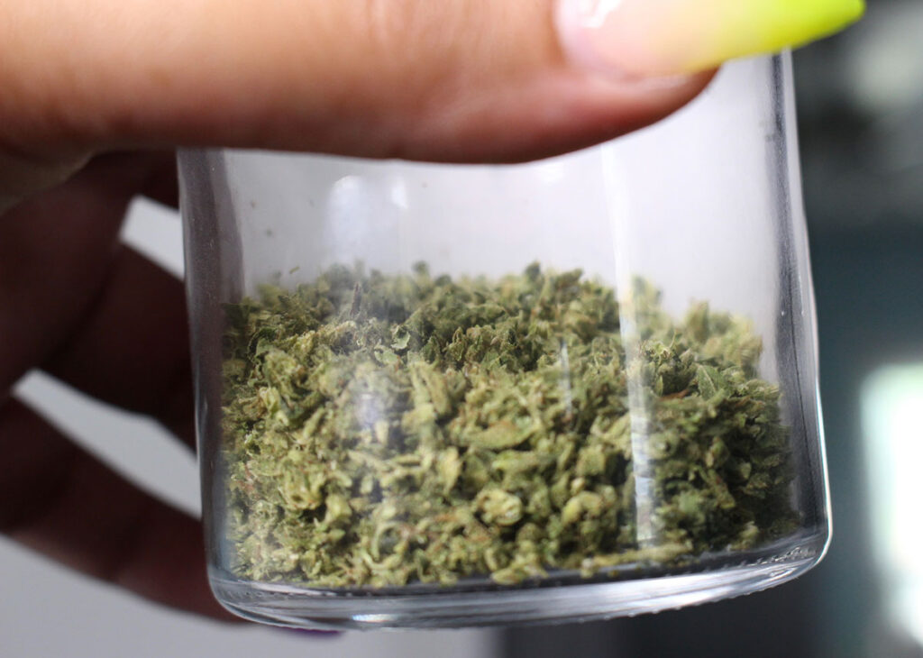 Glass jar with ground-up cannabis