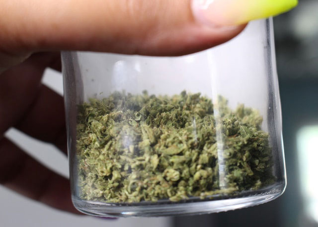 Ground cannabis in a glass ja