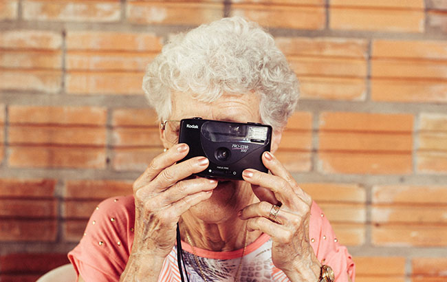 Senior lady holding a camera
