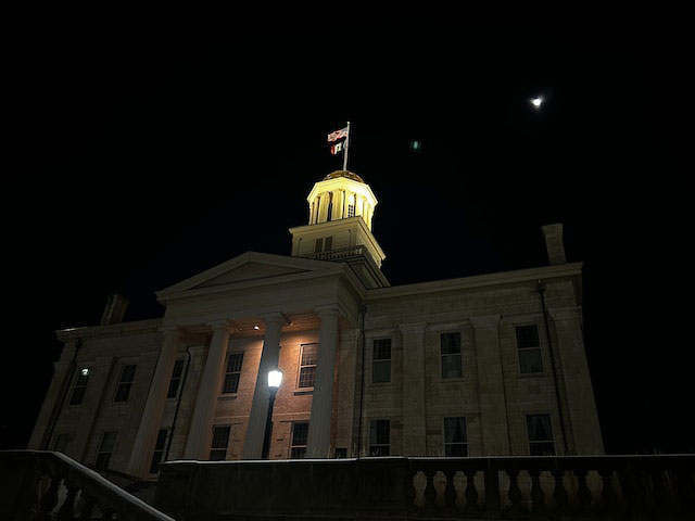 Capitol building with an American flag