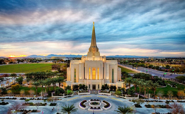 Gilbert Arizona temple against the backdrop of a stunning sunrise or sunset and rolling skies