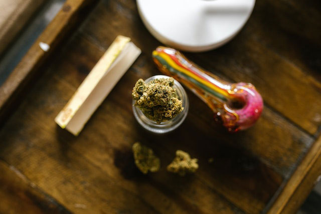 cannabis flower next to a joint